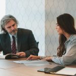 Woman explaining a report to her colleague
