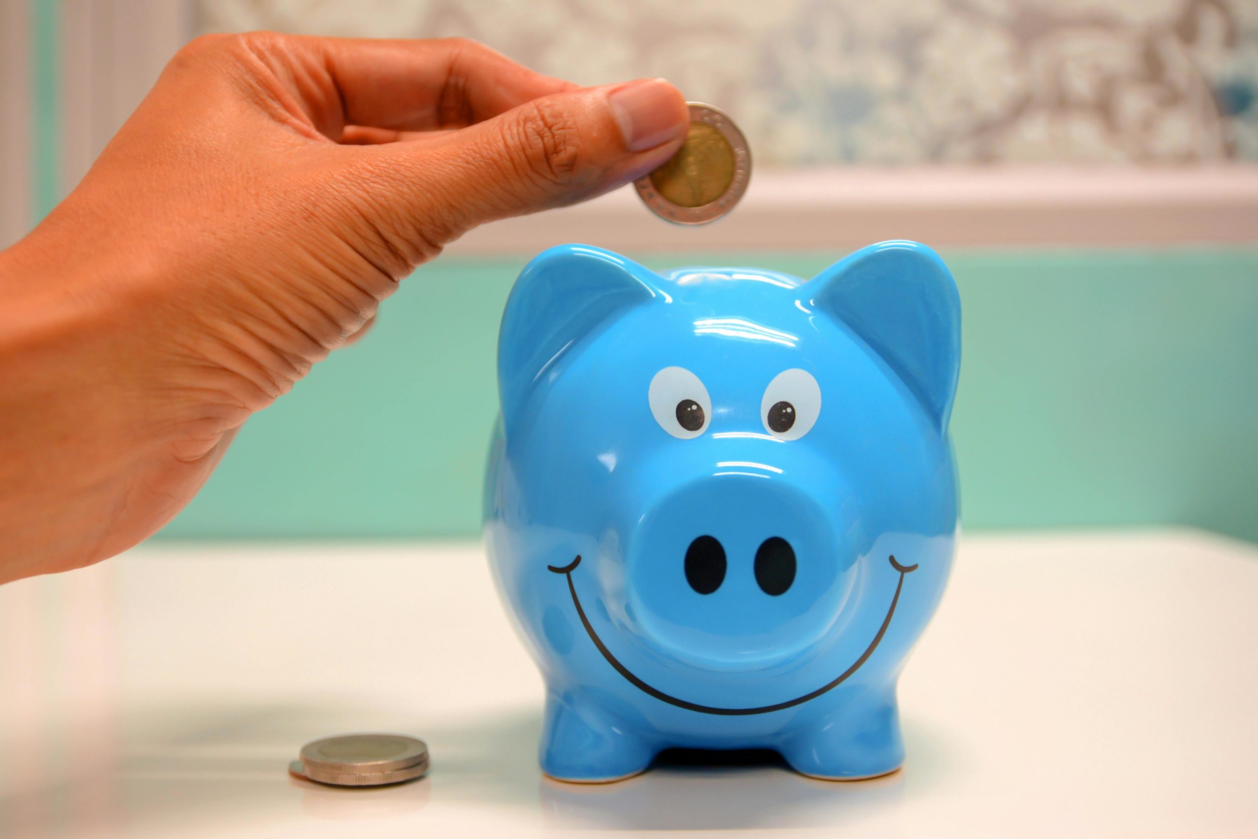Blue smiling piggy bank