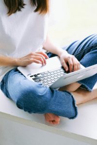 Woman cross legged with laptop